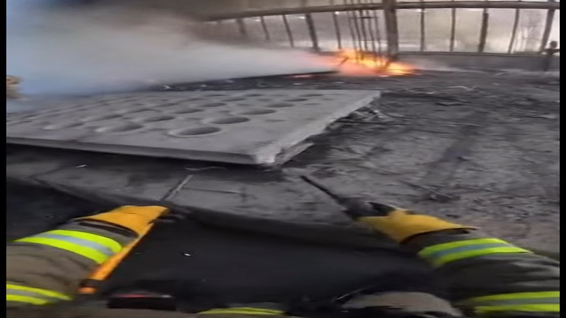 Full Video : N0107068_K In middle of smoke flames, firefighters carefully lifted hea